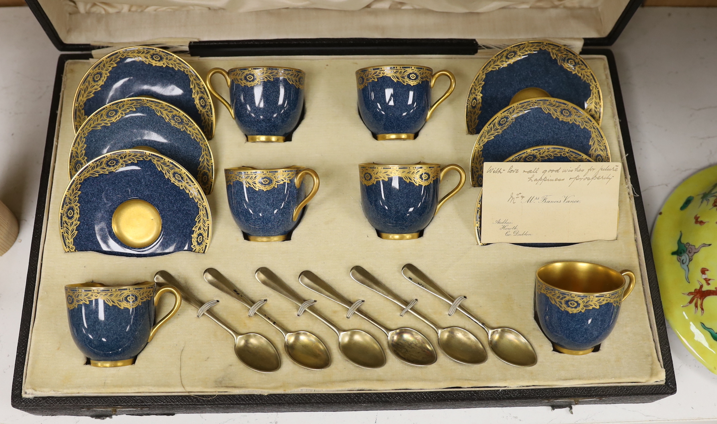 A cased Royal Worcester gilt decorated set of six coffee cans and saucers and six silver coffee spoons, box 10cm high, 41.5cm wide